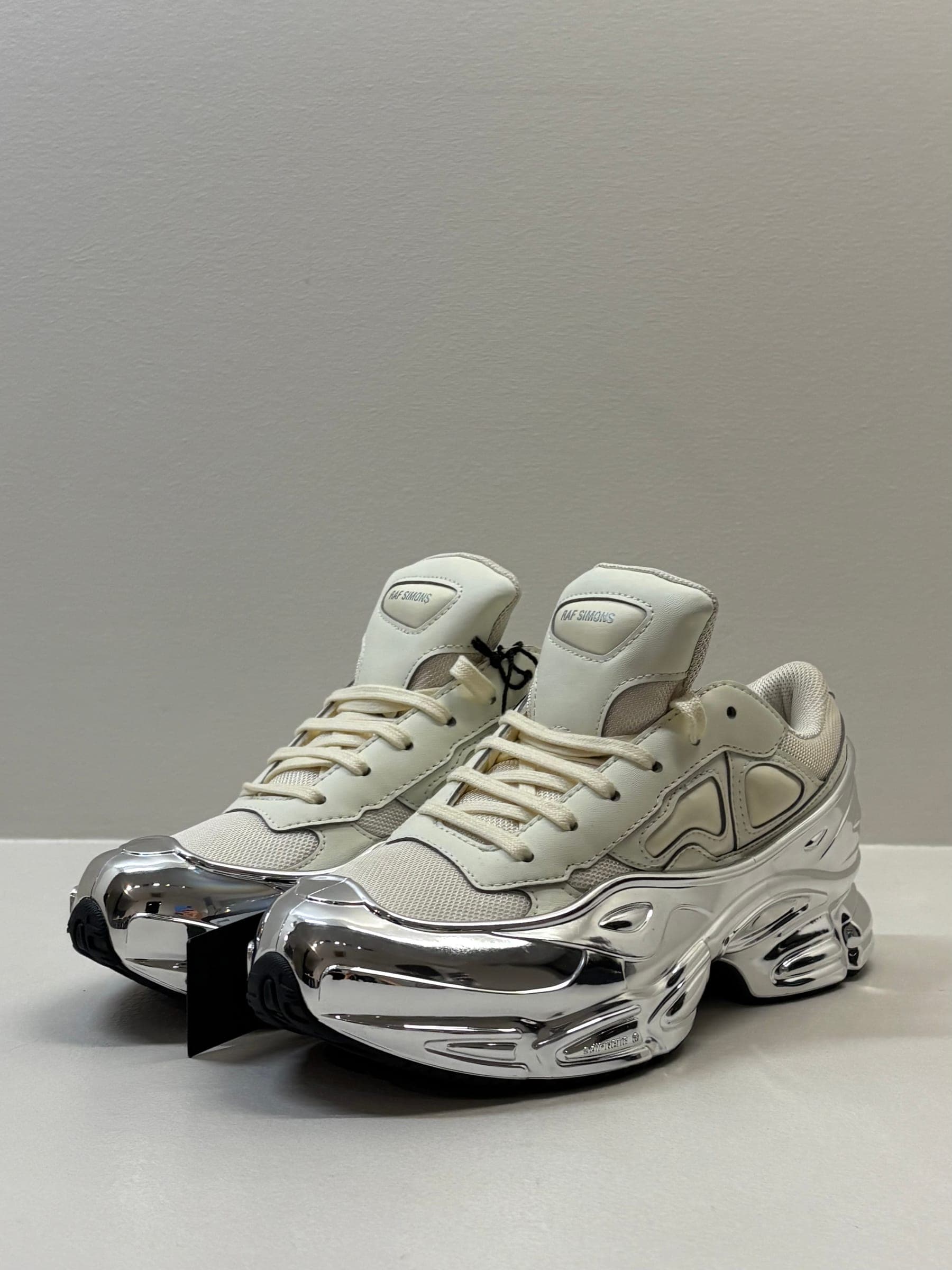 Raf Simons x Adidas Ozweego Silver Cream Sneakers